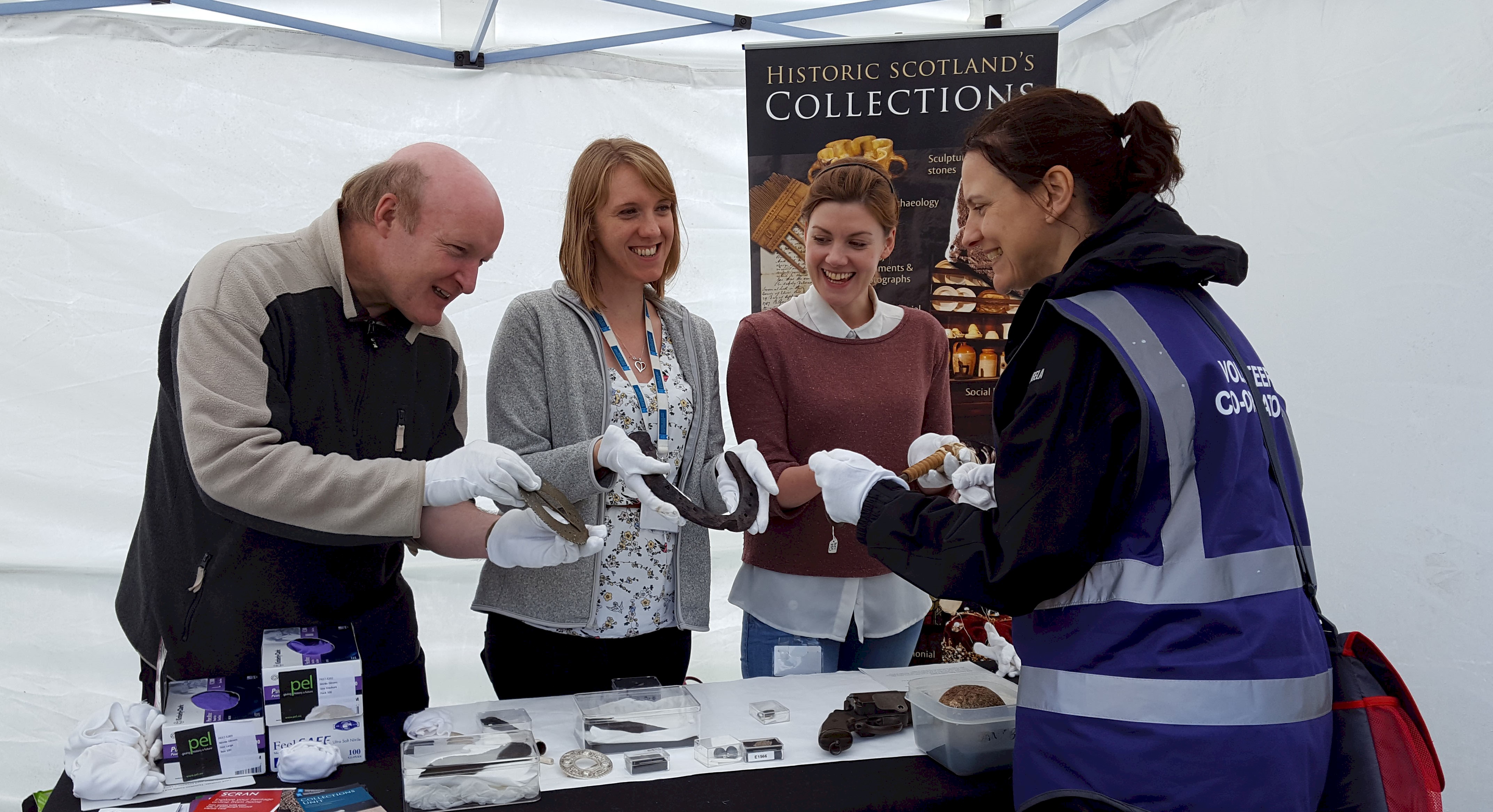 HES staff handling some of the artefacts from our collections 
