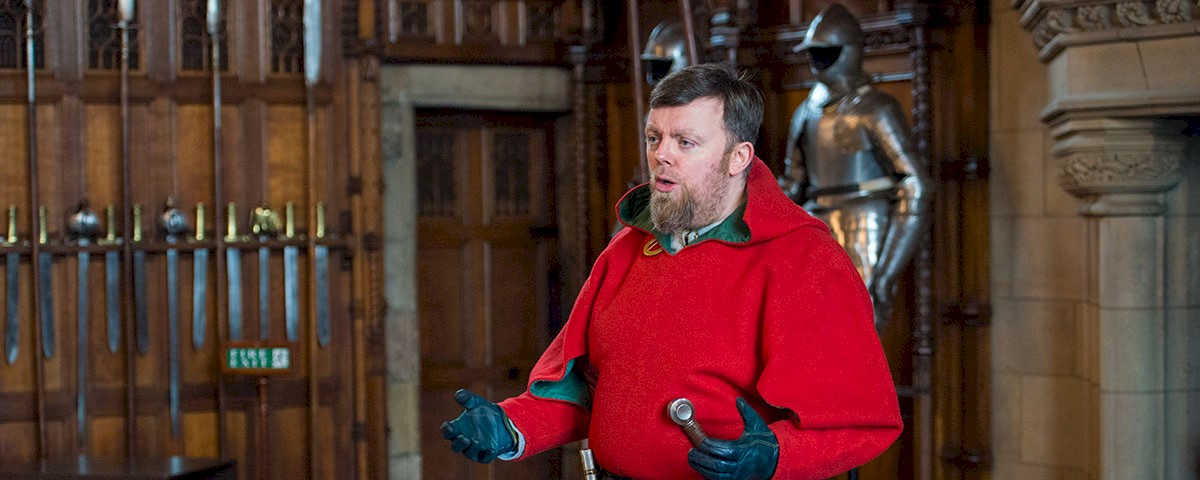 Costumed performer in Edinburgh Castle's Great Hall